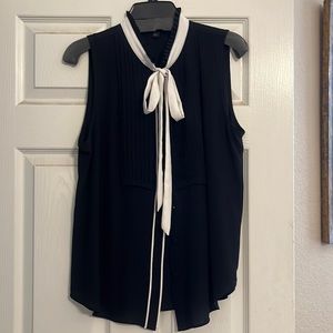 Ann Taylor blouse. Black with white tie. Pleat detailing. Size large.